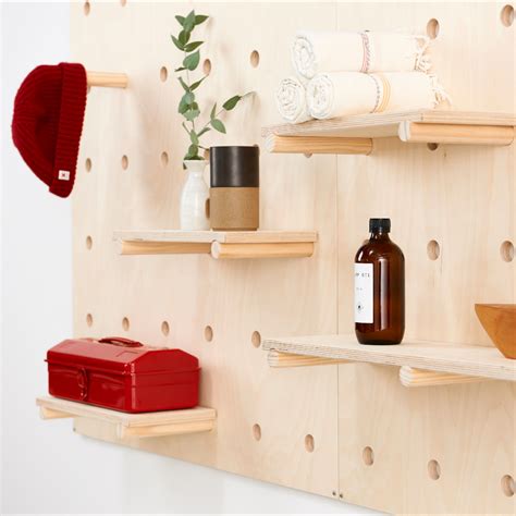 pegboard with shelves and buckets